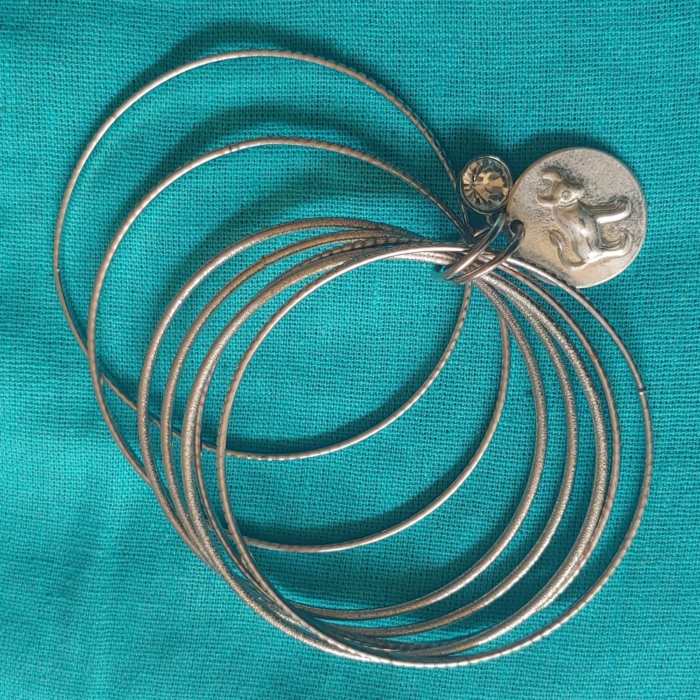 Silver bangles with Taurus bull charm